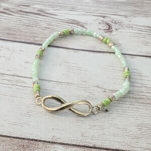 Dainty Bracelet Green Seed Beads with Gold Tone Infinity Symbol